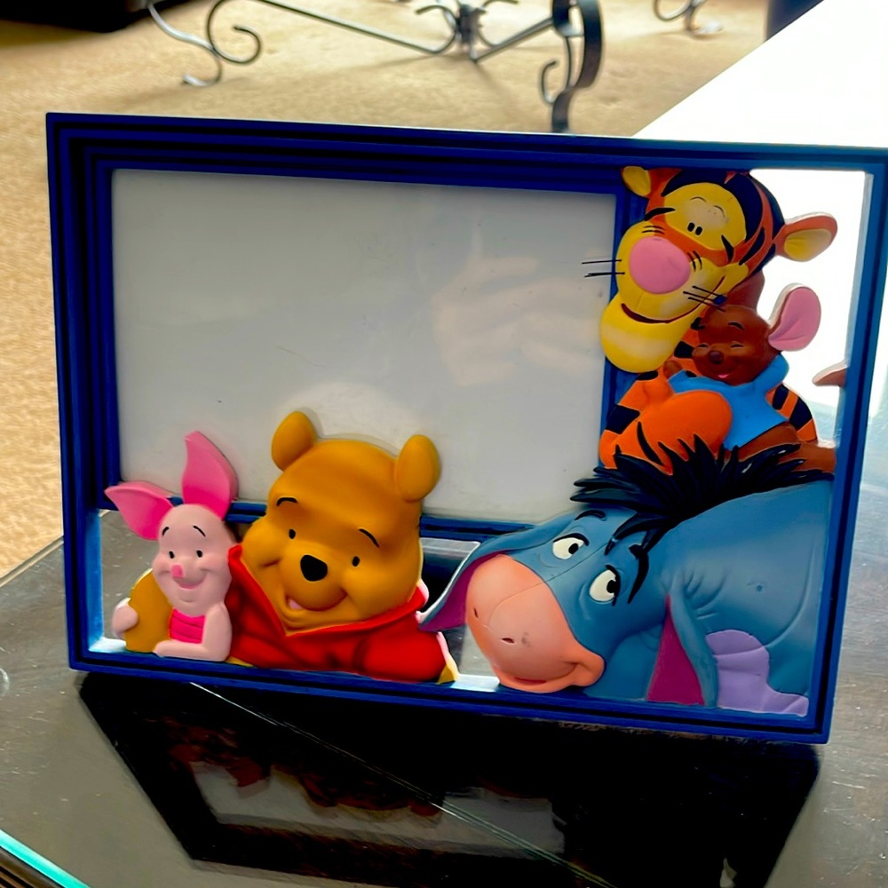 Winnie the Pooh and friends picture frame, 8 3/4 “ by 6 1/2”.